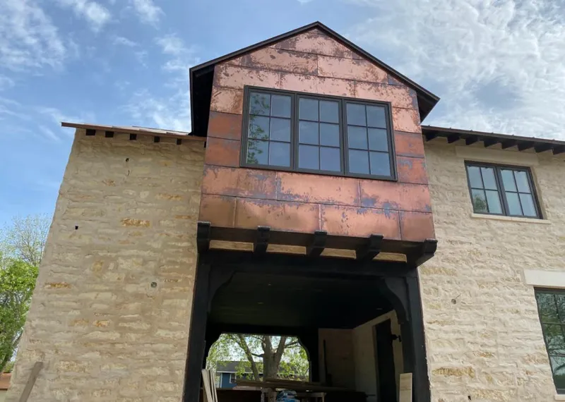Copper metal panel facade on a stone building for Skylight Installation in Arcadia